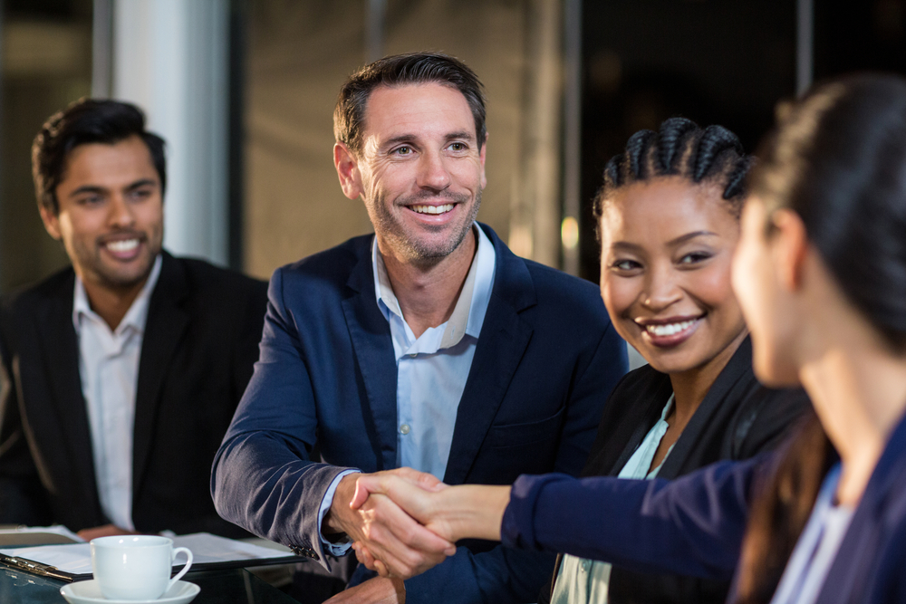 Businessman shaking hands with colleague in the office